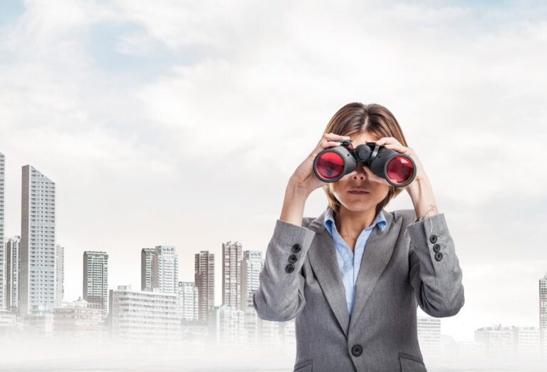 serious worker grey suit using binoculars 1149 106 768x522